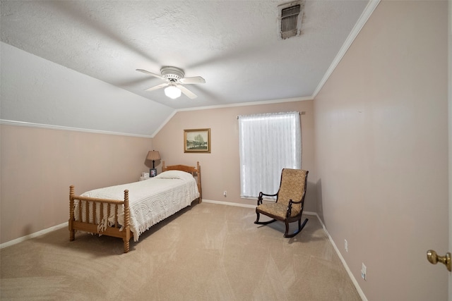 bedroom featuring a textured ceiling, ceiling fan, vaulted ceiling, ornamental molding, and light colored carpet