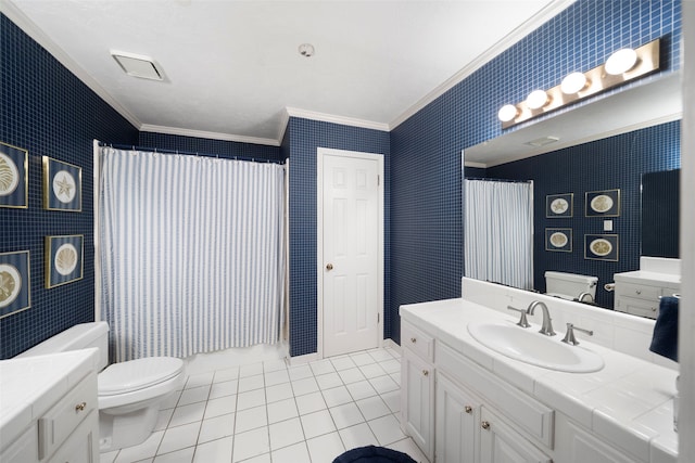 bathroom with vanity, toilet, tile patterned floors, and ornamental molding