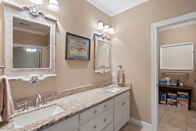 bathroom with vanity, ornamental molding, and tile patterned floors