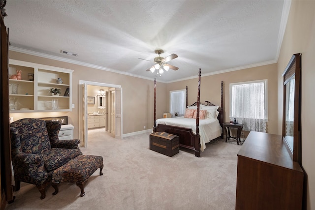 carpeted bedroom with ornamental molding, a textured ceiling, connected bathroom, and ceiling fan