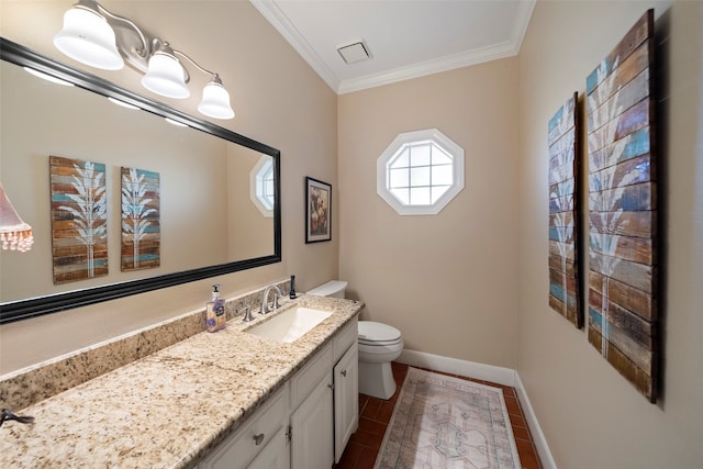 bathroom with vanity, toilet, tile patterned floors, and ornamental molding