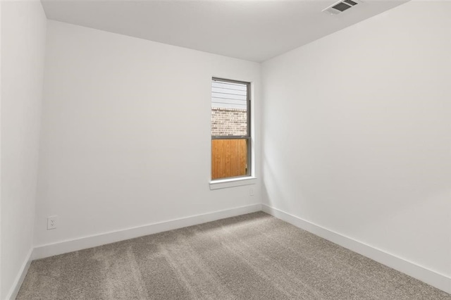 unfurnished room featuring carpet flooring