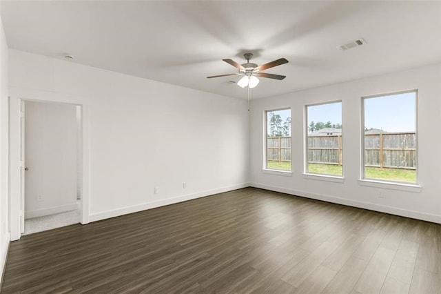 unfurnished room featuring dark hardwood / wood-style flooring and ceiling fan