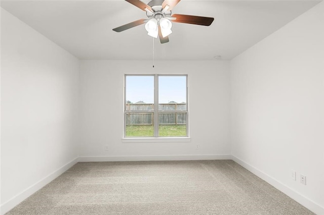 empty room with ceiling fan and carpet