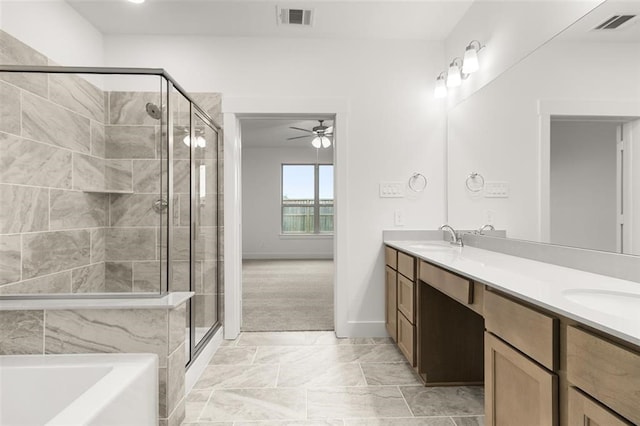 bathroom with vanity, ceiling fan, and separate shower and tub