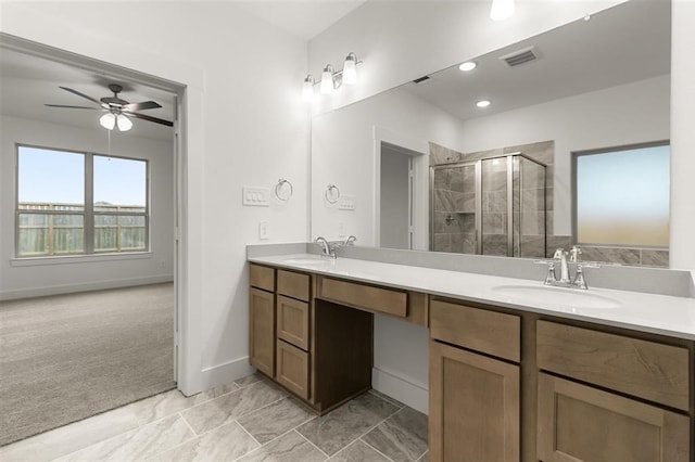 bathroom featuring walk in shower, vanity, and ceiling fan