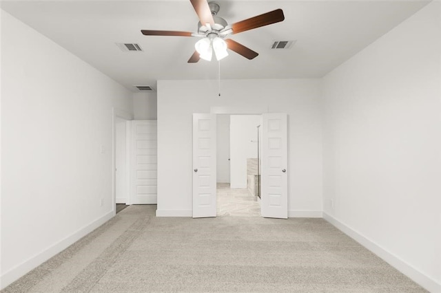 unfurnished bedroom featuring carpet floors, visible vents, and baseboards