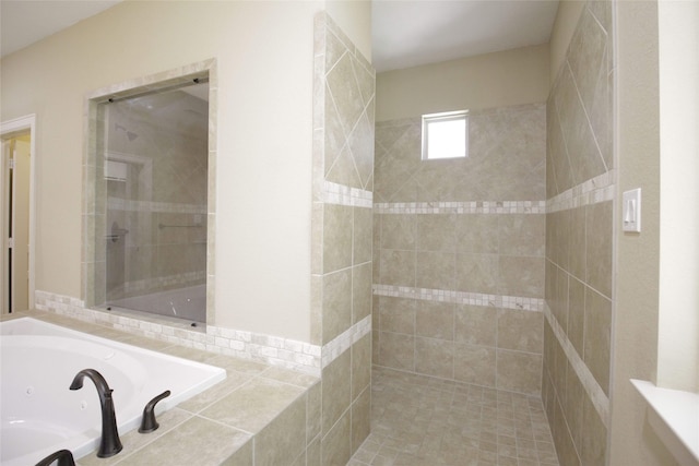 bathroom with a relaxing tiled bath