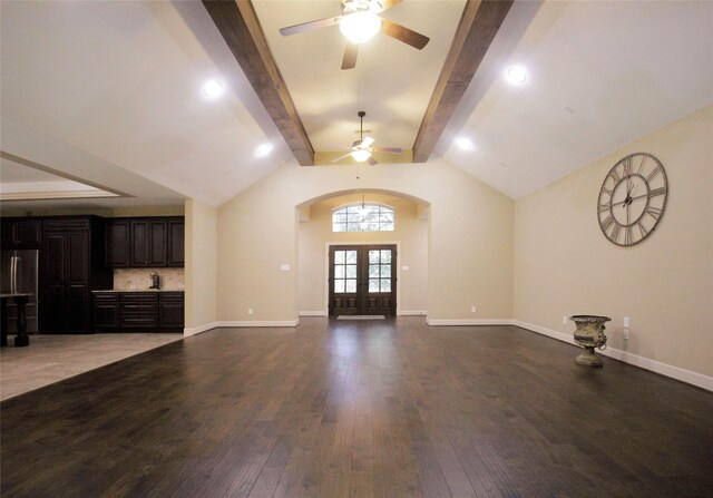 unfurnished living room with french doors, lofted ceiling with beams, ceiling fan, and hardwood / wood-style floors