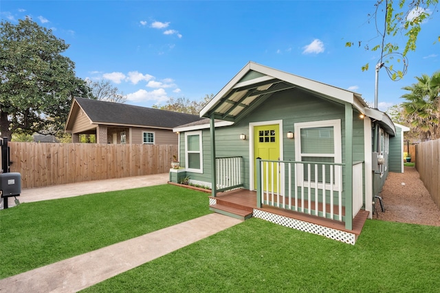 rear view of house with a yard