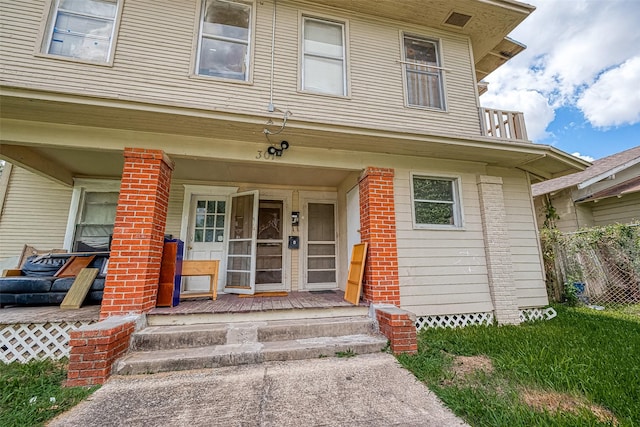 doorway to property featuring a porch