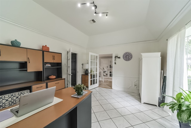 kitchen with a wealth of natural light, light tile floors, and french doors