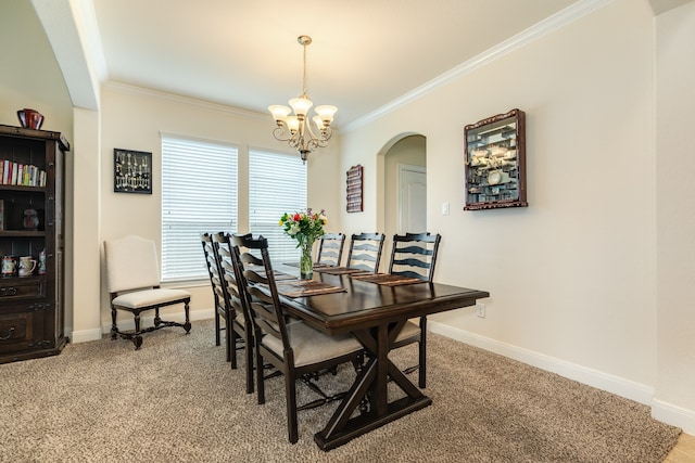 carpeted dining space with a notable chandelier and ornamental molding