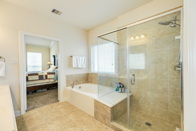 bathroom featuring tile floors, ceiling fan, and plus walk in shower