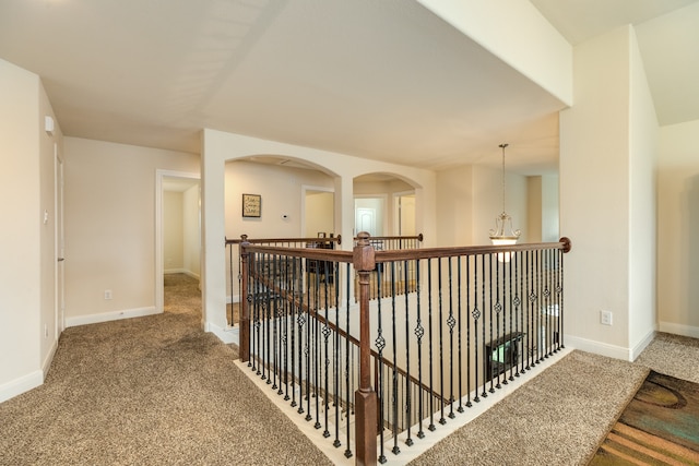 hallway with carpet flooring