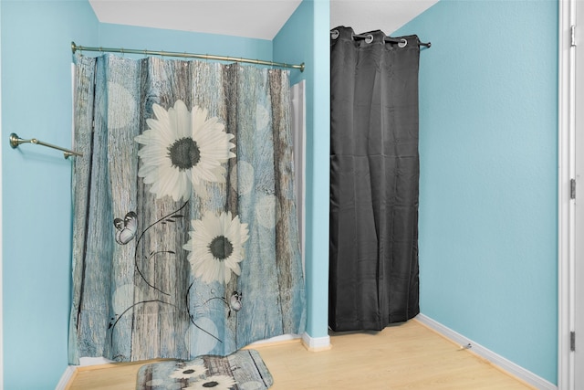 bathroom with hardwood / wood-style flooring