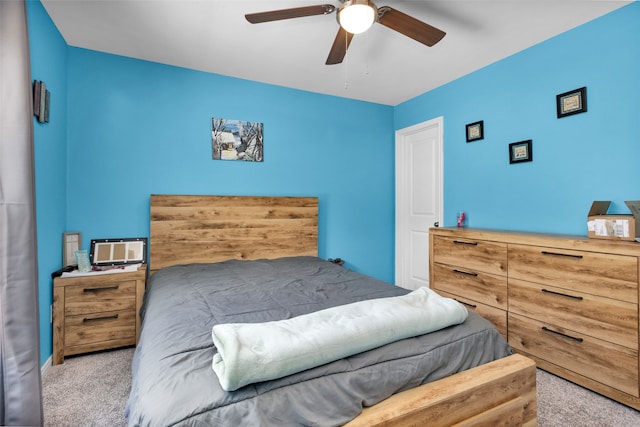 carpeted bedroom featuring ceiling fan