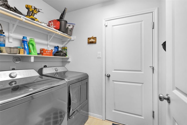 laundry area featuring light hardwood / wood-style flooring and independent washer and dryer