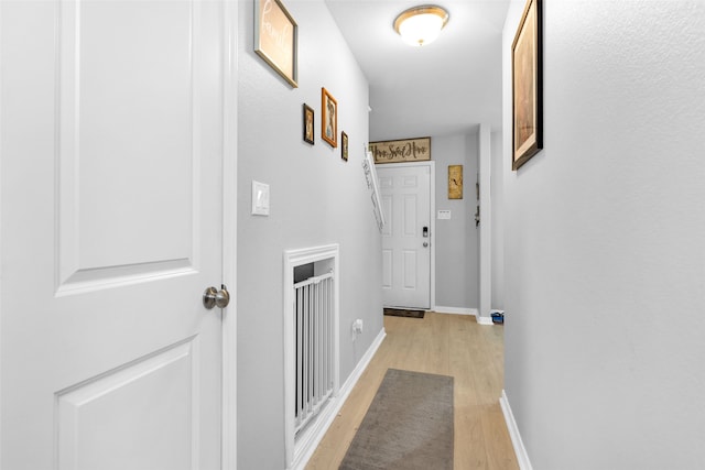 corridor featuring light hardwood / wood-style floors