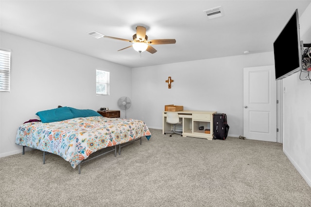 bedroom with ceiling fan and carpet floors