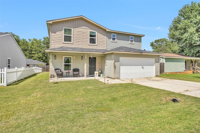 front of property featuring a garage and a front lawn