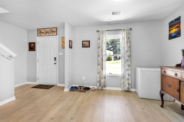 foyer with light hardwood / wood-style flooring