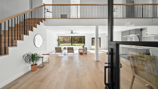 entryway featuring ceiling fan and light hardwood / wood-style flooring