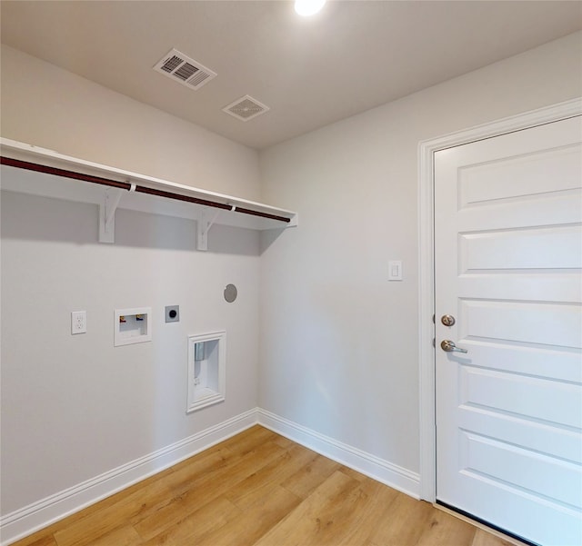 clothes washing area with electric dryer hookup, light wood-type flooring, and hookup for a washing machine