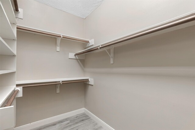 walk in closet featuring light hardwood / wood-style floors