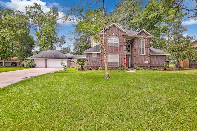 view of property featuring a garage and a front lawn