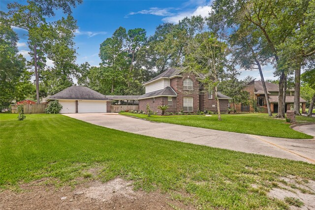 view of front of home featuring a front yard and a garage