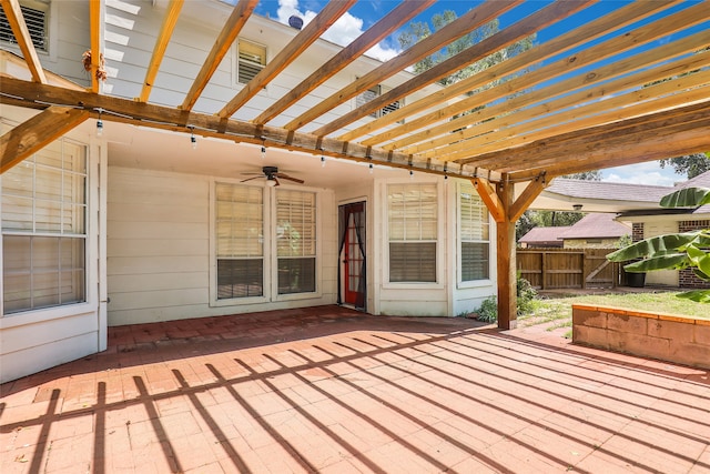 deck with ceiling fan, a pergola, and a patio