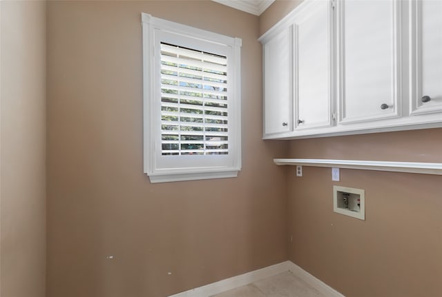 laundry room featuring washer hookup and cabinets