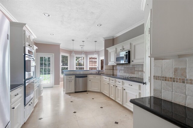 kitchen with kitchen peninsula, light tile flooring, white cabinetry, and appliances with stainless steel finishes