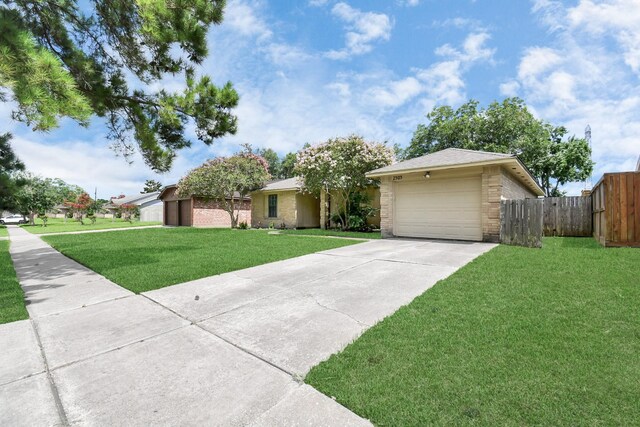 ranch-style home with a garage and a front yard