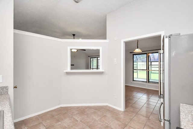 interior space featuring ceiling fan and ornamental molding