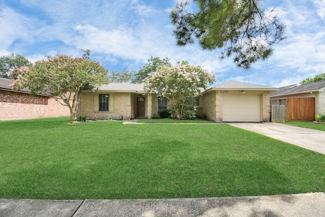 single story home featuring a front lawn and a garage