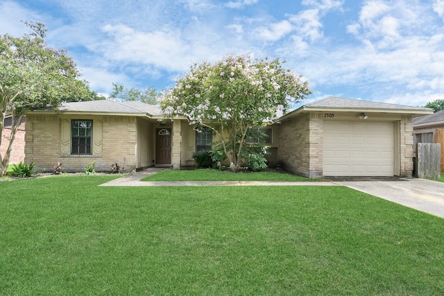 ranch-style home with a front yard and a garage