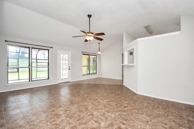 unfurnished living room featuring ceiling fan, lofted ceiling, and a textured ceiling