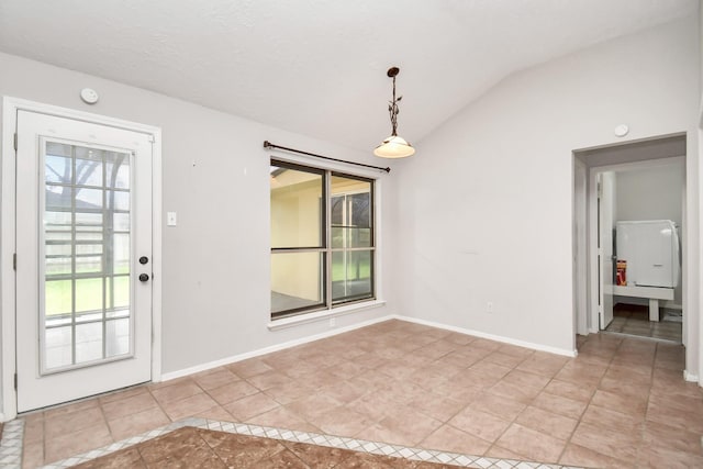 interior space featuring light tile patterned floors and lofted ceiling