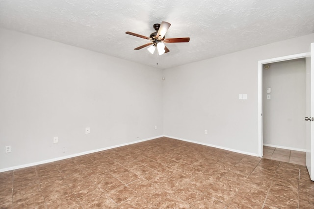 empty room featuring ceiling fan and a textured ceiling