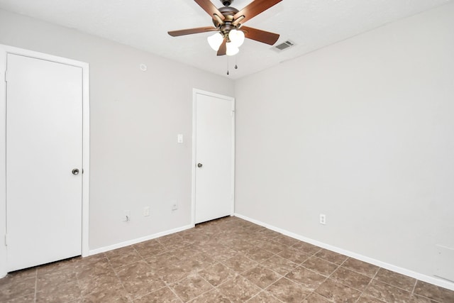 spare room with ceiling fan