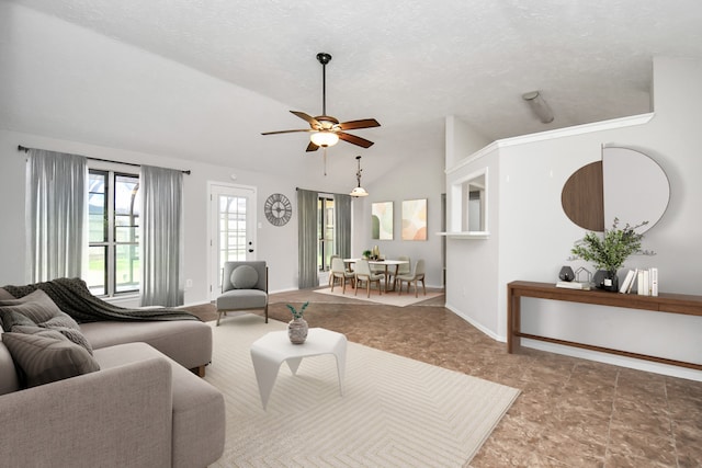 living room with a textured ceiling, ceiling fan, and lofted ceiling