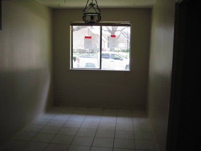 view of tiled spare room