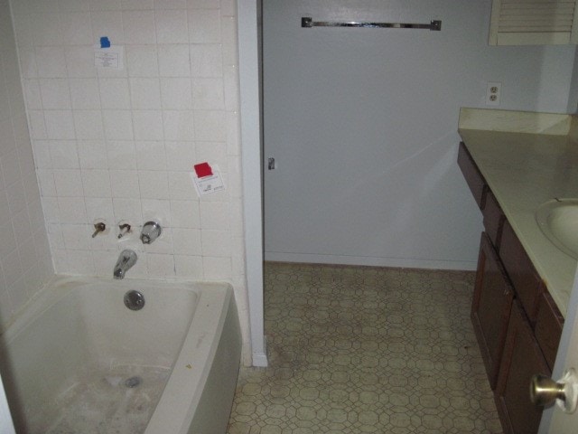 bathroom featuring tile flooring and vanity