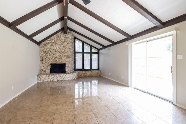 unfurnished living room featuring high vaulted ceiling, beam ceiling, a fireplace, and a wealth of natural light