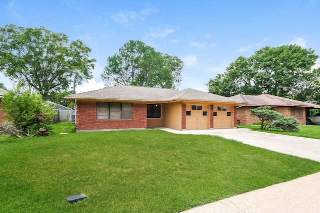 ranch-style home with a garage and a front lawn