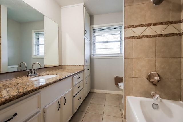 full bathroom featuring tile patterned floors, a wealth of natural light, vanity, and toilet