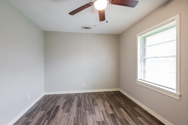 unfurnished room featuring dark hardwood / wood-style floors and ceiling fan