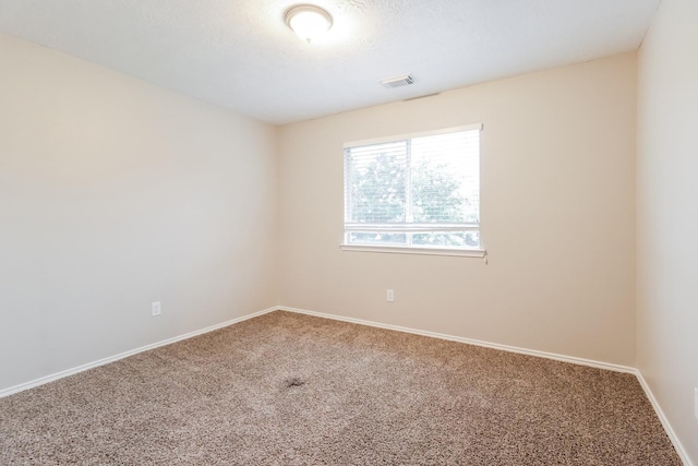 empty room featuring carpet flooring